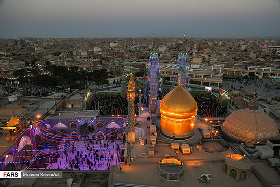 گزارش تصویری تعویض پرچم گنبد حرم حضرت معصومه(س) 